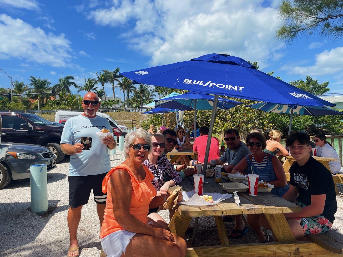 Friends gathered at the waterfront tables