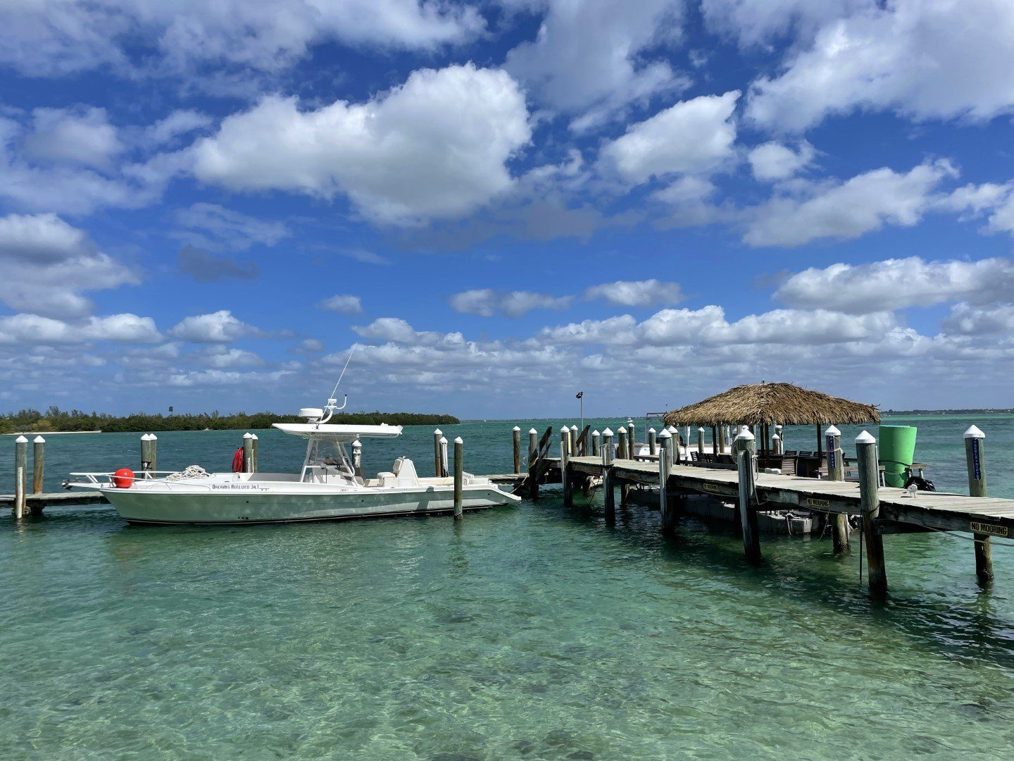 The dock over the teal water of New Pass