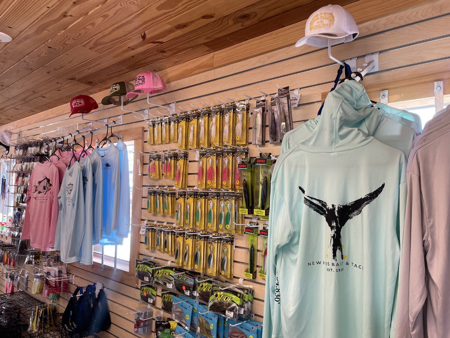 Racks of New Pass apparel inside the shop