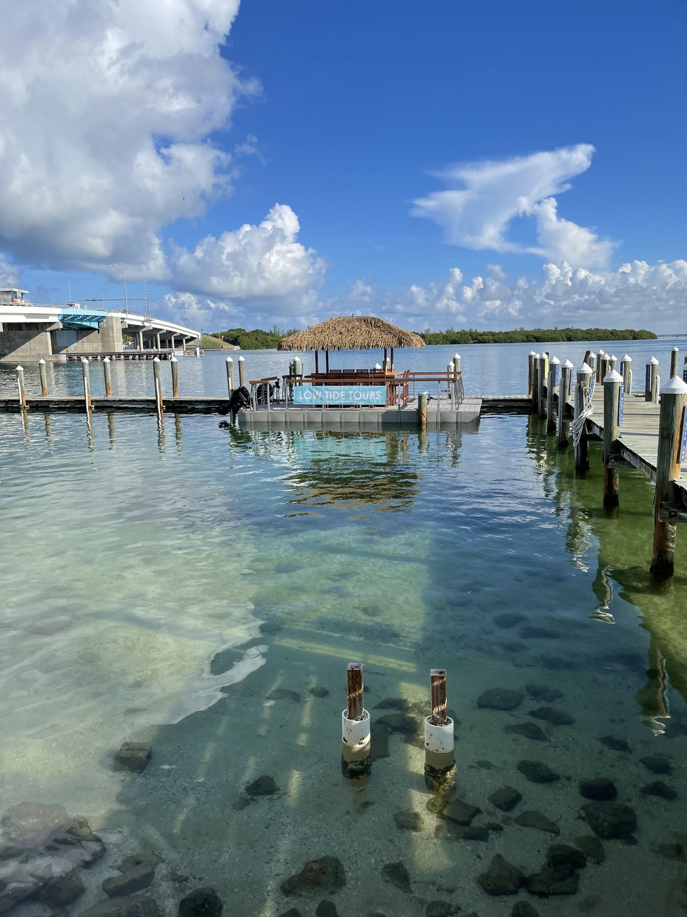 The tiki hut and dock over the clear shallows at New Pass